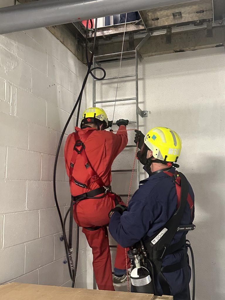 Delegate climbing ladder in enclosed space