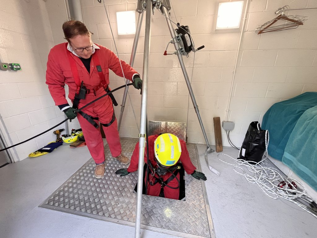 Delegate lowering into enclosed space hatch