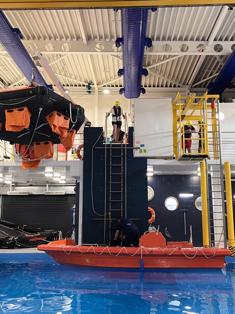 Image of a Pilot Ladder Transfer course with a fast rescue boat at the bottom of a ladder, for the Pilot's to safely practice ascending and descending. 