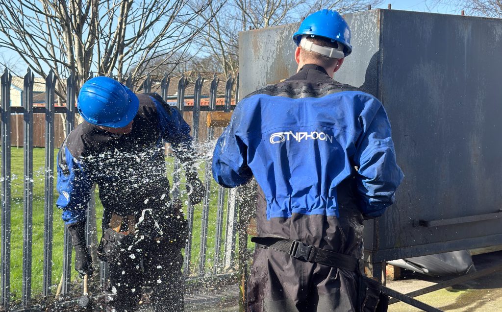 Damage control delegates practicing leak management. Using a simulation box