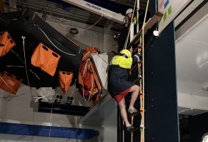 Maritime Skills Academy delegate climbing pilot ladder during marine pilot ladder transfer training