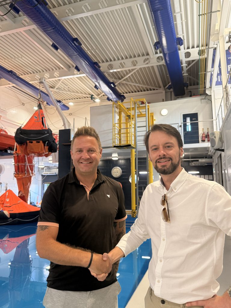 image of Operations Director Mark Jaenicke shaking hands with UKMPA Vice Chair, Jason Wiltshire at the Maritime Skills Academy